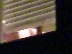 Bbw in the window getting ready for bed